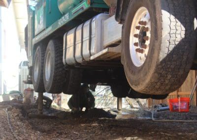 men working with well drilling machine